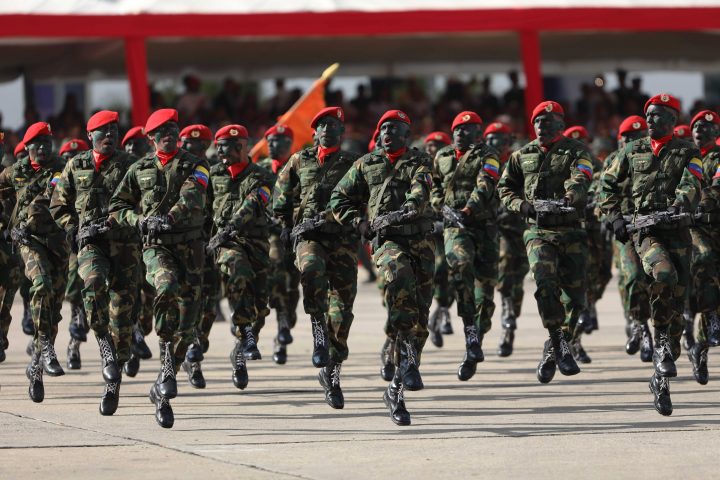 Soldiers, armed with Russian-made rifles, participate in a military act hours after Venezuelan President Nicolas Maduro was sworn again as president of the country, in Caracas, Venezuela, on Jan. 10, 2019.