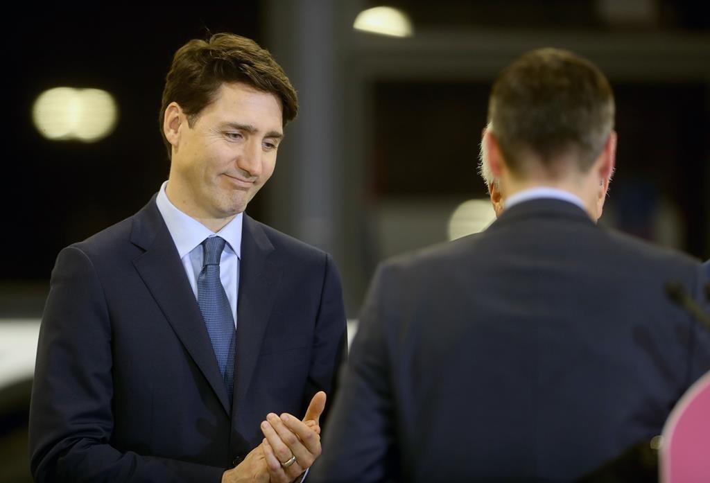 Winnipeg mayor Brian Bowman finishes speaking as Prime Minister Justin Trudeau looks on in this file photo.