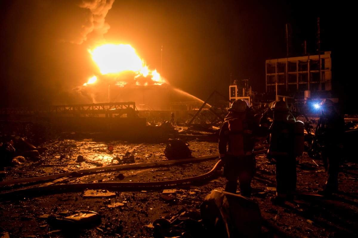 Firefighters work on extinguishing the fire following an explosion at the pesticide plant owned by Tianjiayi Chemical, in Xiangshui county, Yancheng, Jiangsu province, China March 21, 2019. Picture taken March 21, 2019. REUTERS/Stringer 