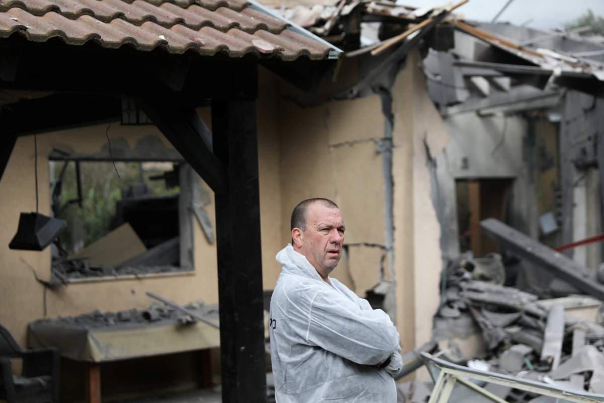An Israeli police sapper looks on as he works at the site of a house that was hit by a rocket north of Tel Aviv, Israel March 25, 2019.