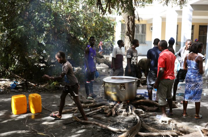 Evacuees from Buzi village prepare a meal at a displacement center, after Cyclone Idai, in Beira, Mozambique, March 25, 2019.