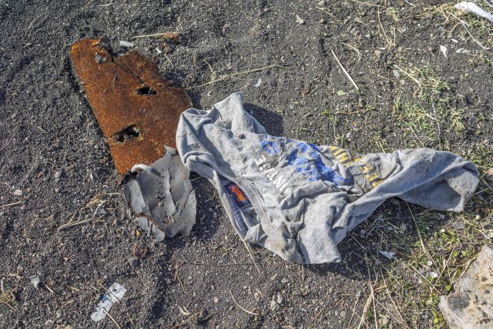 Clothing lies on the ground at the crash scene of an Ethiopian Airlines flight crash near Bishoftu, or Debre Zeit, south of Addis Ababa, Ethiopia, Monday, March 11, 2019.