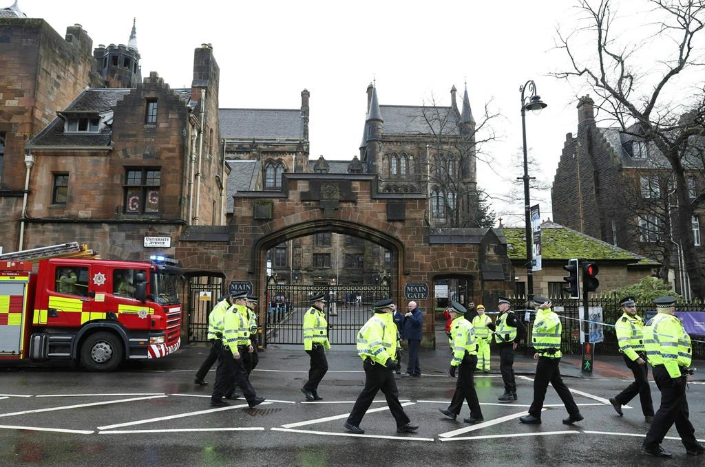 Police and fire services outside the University of Glasgow after the building was evacuated when a suspect package was found in the mailroom, in Glasgow, Scotland, Wednesday March 6, 2019.
