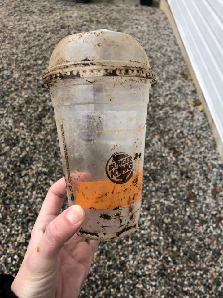The cup Krasuin pulled from the skunk’s head. She said she was surprised at how firmly the lid was clamped onto the cup.
