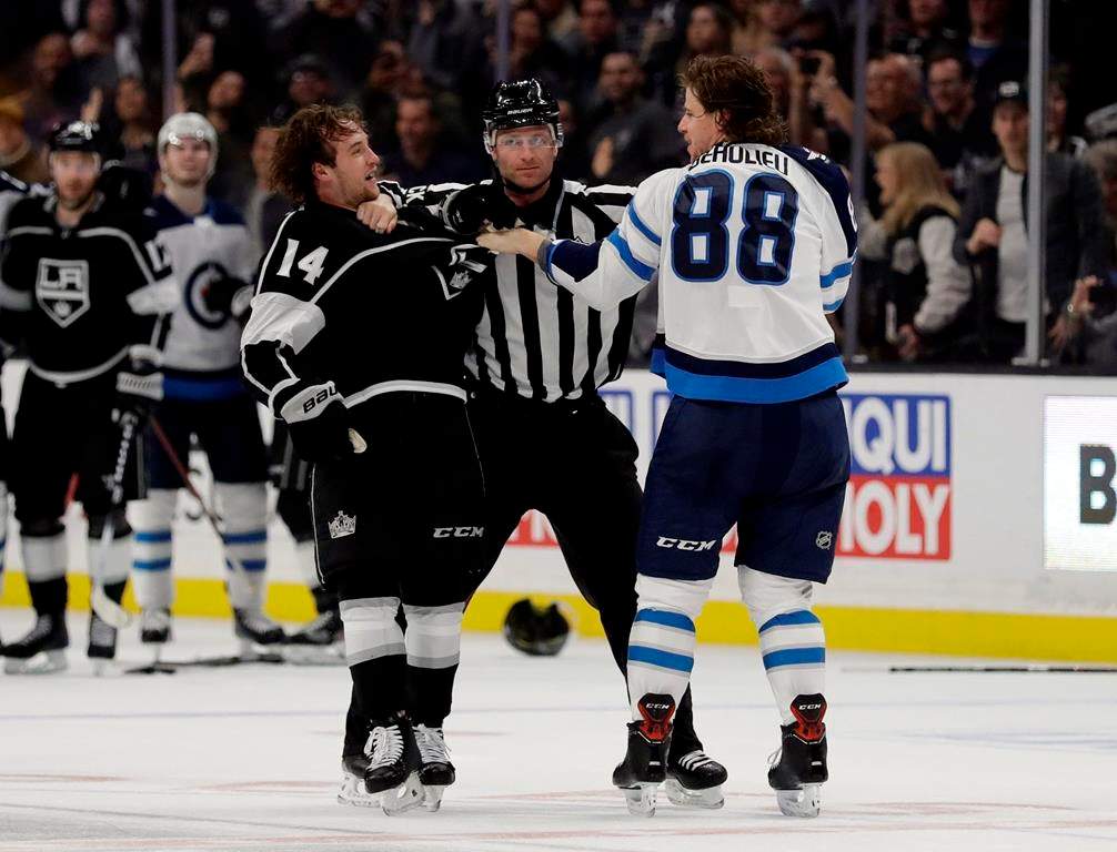 Winnipeg Jets’ Nathan Beaulieu (88) fights during a 2019 game. (AP Photo/Marcio Jose Sanchez)