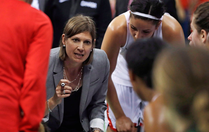 Canada head coach Lisa Thomaidis talks to the team during the second half of a women's basketball game against Serbia at the Youth Center at the 2016 Summer Olympics in Rio de Janeiro, Brazil, Monday, Aug. 8, 2016. 
