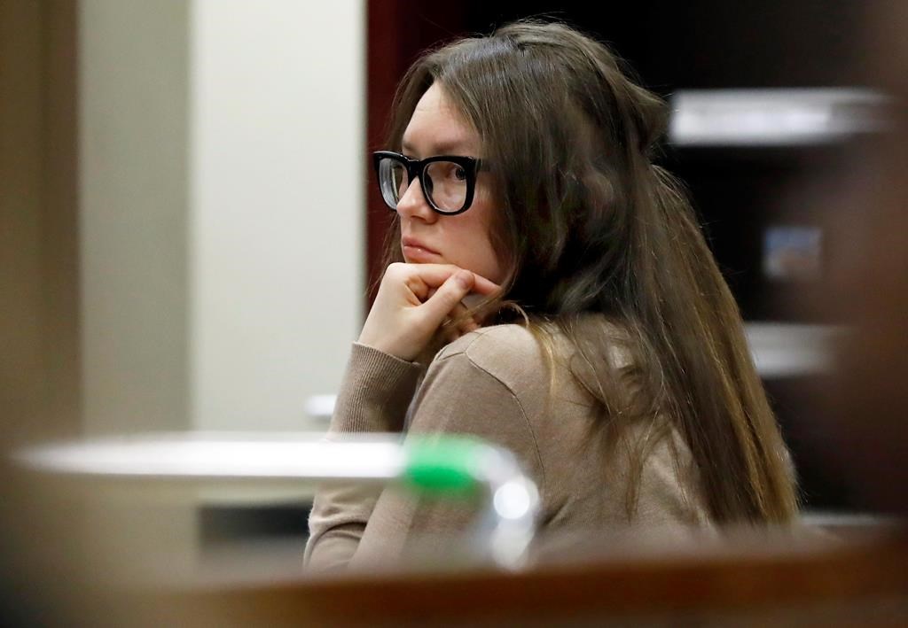 Anna Sorokin listens as her defense attorney Todd Spodek delivers his opening statement in her trial in New York State Supreme Court, Wednesday, March 27, 2019, in New York,
