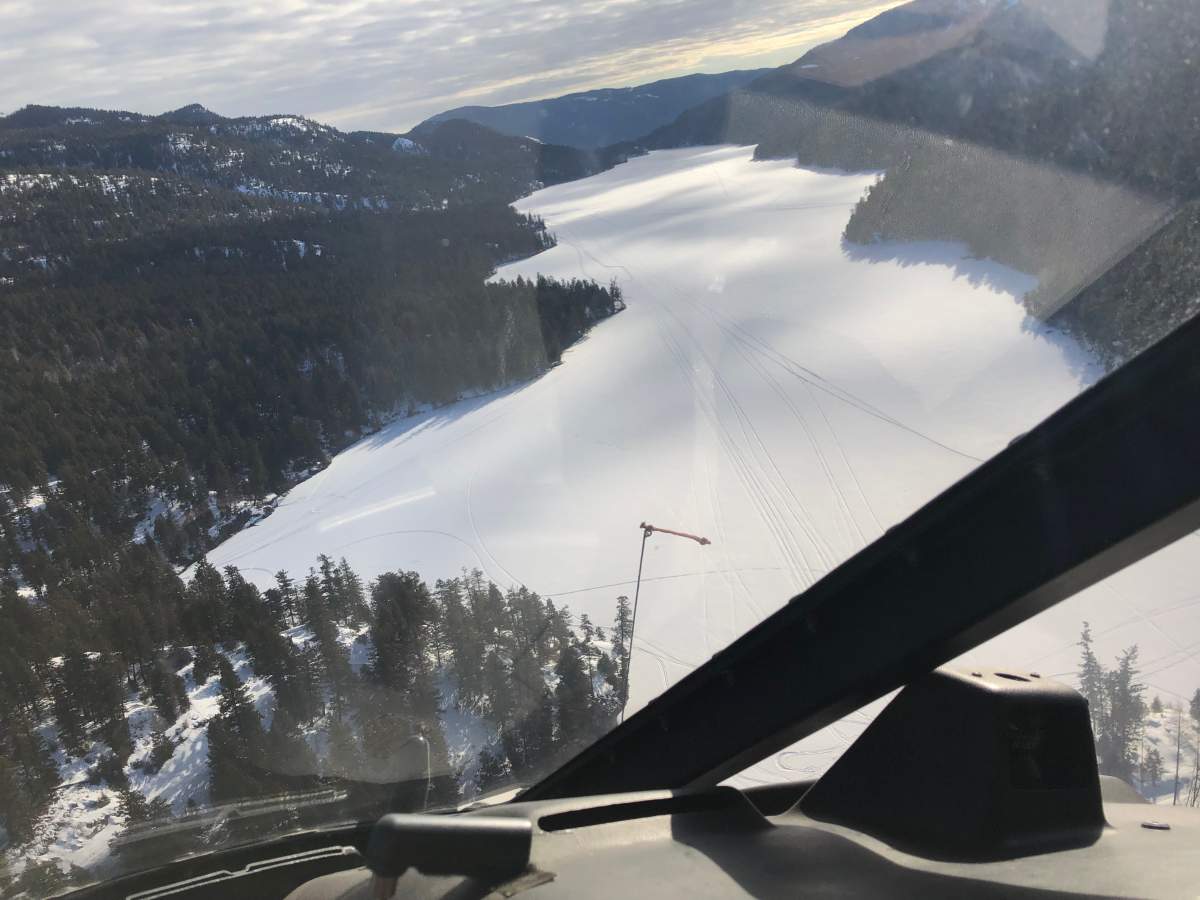 Helicopters were deployed to search for the snowmobilers from the air.