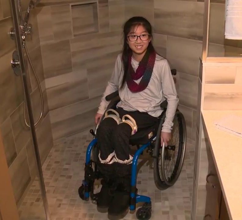 Hailey Cheng, 12, shows off the new accessible shower inside her home in Sherwood Park, Alta. Where builder Alair Homes carried out a big renovation to make the house wheelchair-friendly. Monday, March 4, 2019.