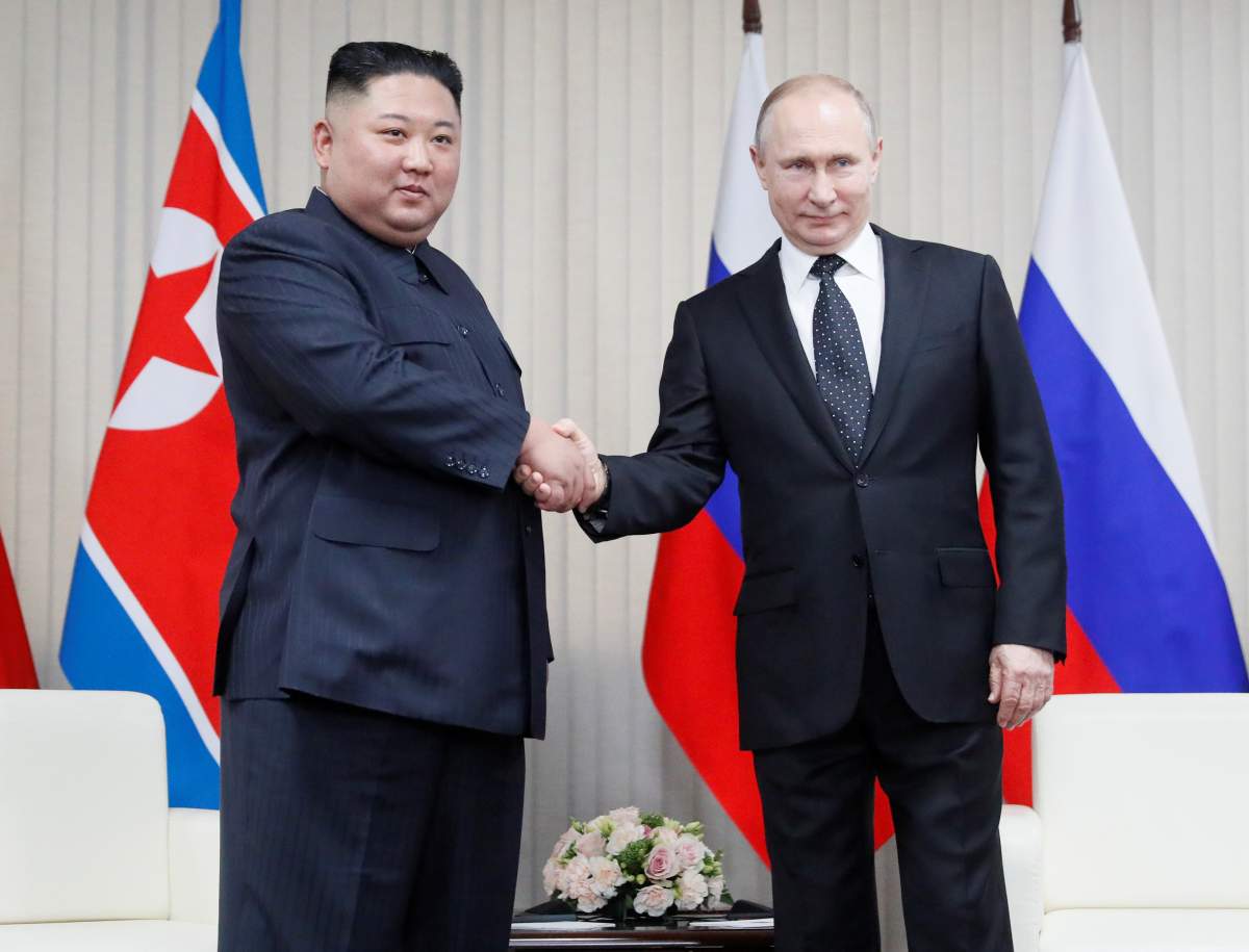 Russian President Vladimir Putin (R) and North Korean leader Kim Jong Un shakes hands during their talks at Far East Federal University on Russky Island in Vladivostok, Russia, April 25, 2019.