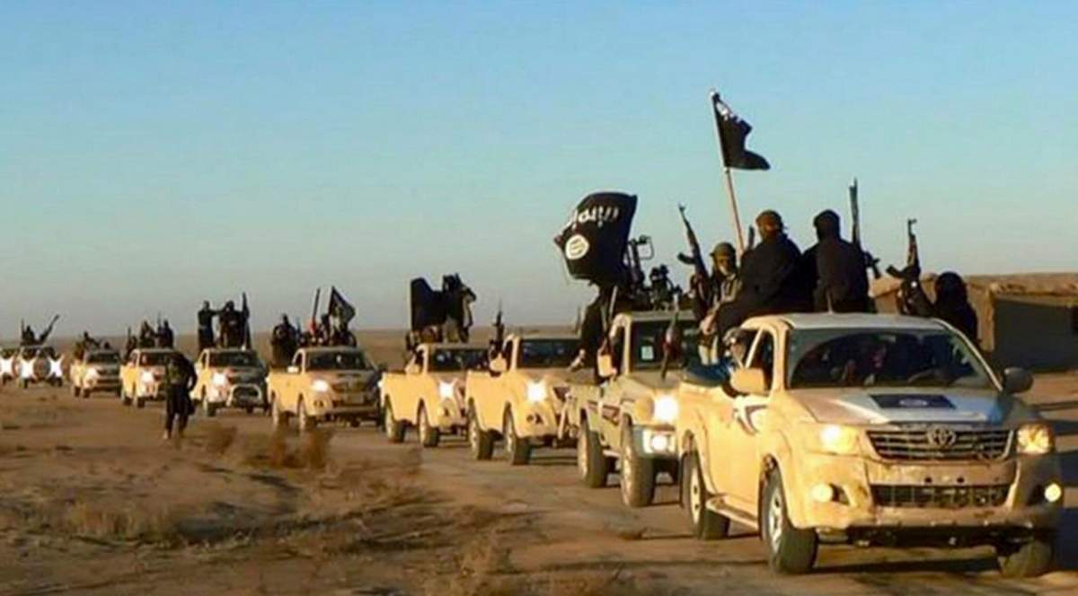 An ISIS convoy on a road leading to Iraq, in Raqqa, Syria, 2014. (Militant photo via AP, File).