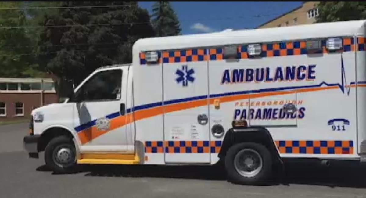 A man has been charged with forcible confinement after police allege he prevented paramedics from leaving a scene.