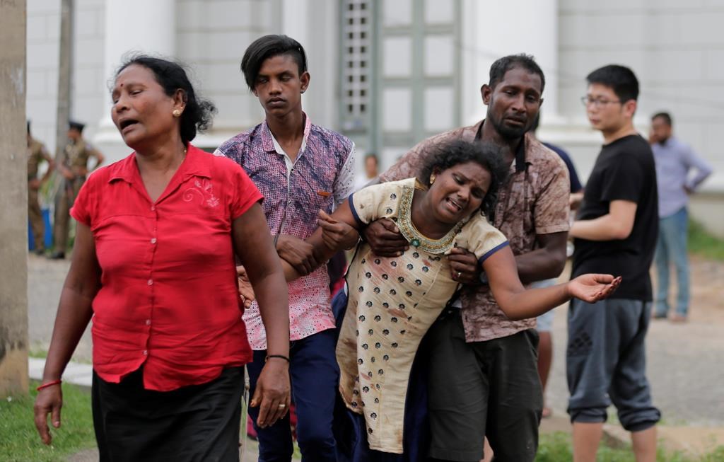 Relatives of a blast victim grieve outside a morgue in Colombo, Sri Lanka, Sunday, April 21, 2019.