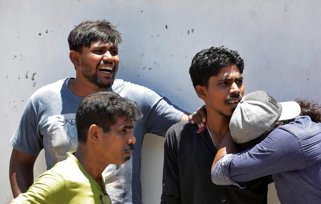 Relatives of a blast victim weep outside a police morgue in Colombo, Sri Lanka, Sunday, April 21, 2019. More than two hundred people were killed and hundreds more injured in eight blasts that rocked churches and hotels in and just outside Sri Lanka’s capital on Easter Sunday. (AP Photo/Eranga Jayawardena)