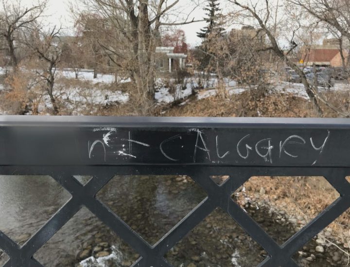 An obscene message, blurred by Global News, along a pathway in Calgary’s Mission neighbourhood.