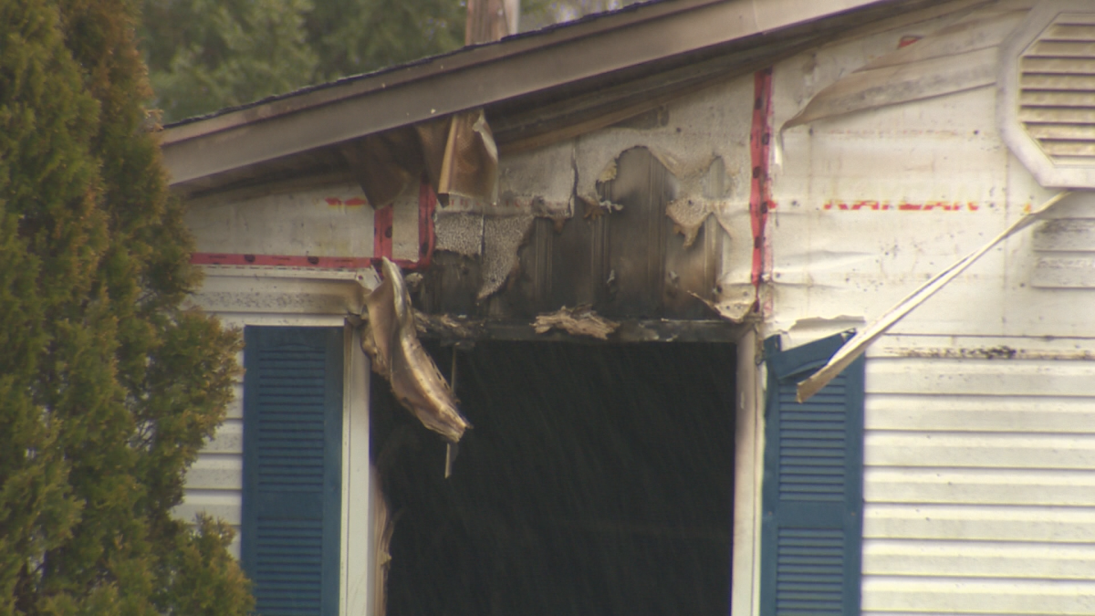 Mounties say the home was engulfed in flames when they arrived on scene.