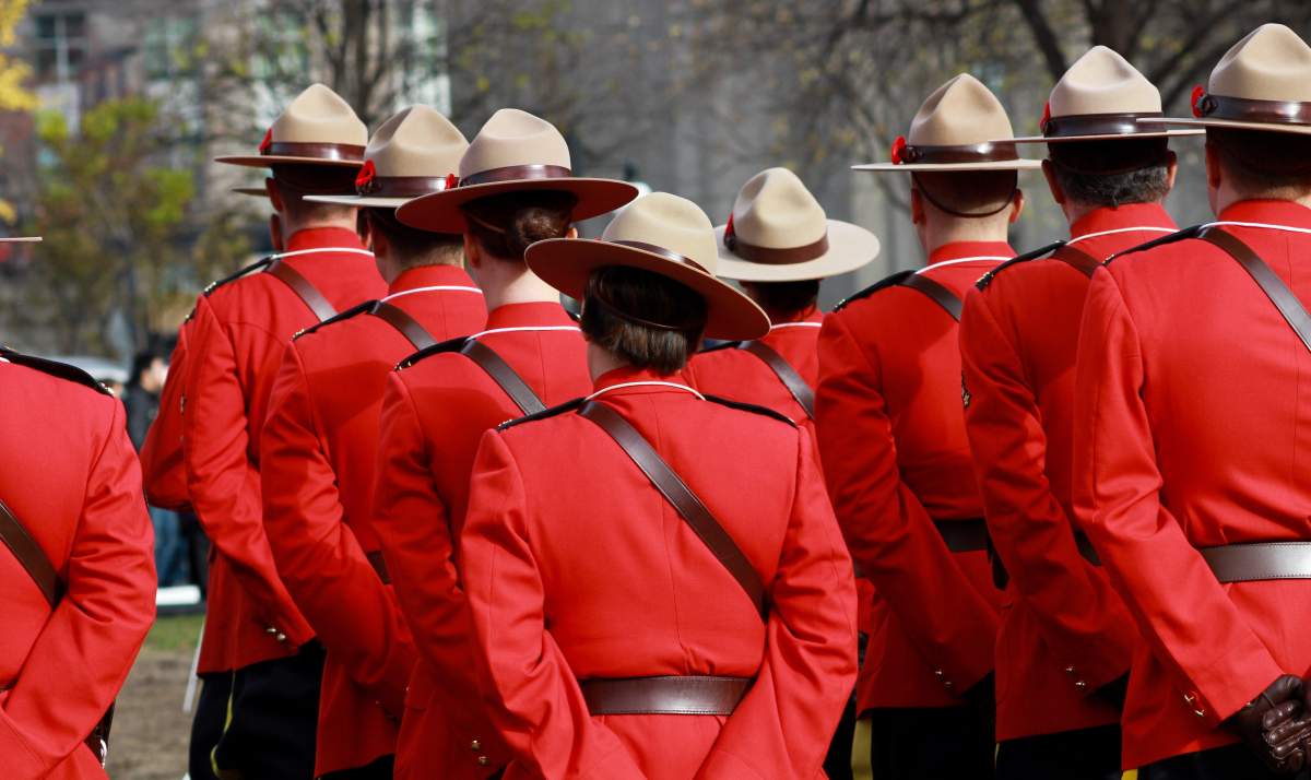 Mounties are pictured in red serge.  