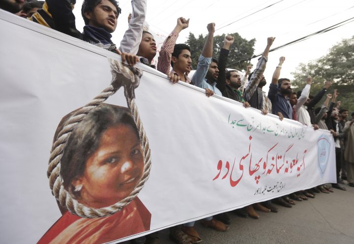 People shout slogans as they protest the release of Asia Bibi, a Christian accused of blasphemy, whose death sentence was annulled by the Supreme court, in Lahore, Pakistan, November 2018.