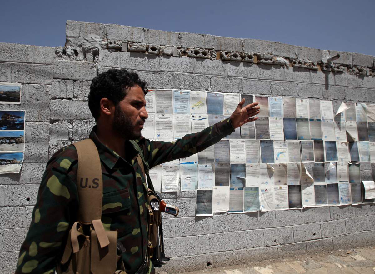 A Houthi militant gestures as he secures the site of a protest by staffers of the Houthi-run Yemen's state oil company outside the United Nations offices to demand easing the restrictions on oil shipments to Houthi-held ports, in Sanaa, Yemen April 15, 2019. 