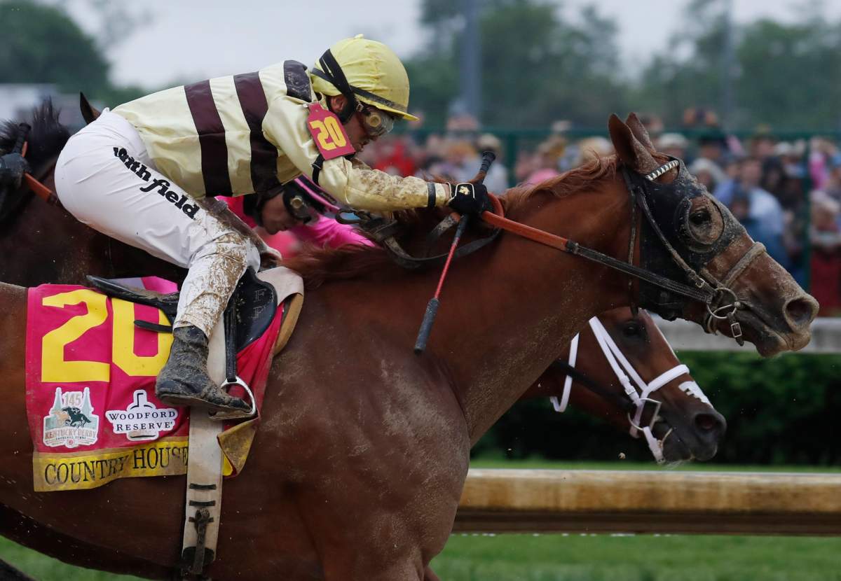 Flavien Prat aboard Country House (20) races during the 145th running of the Kentucky Derby at Churchill Downs.
