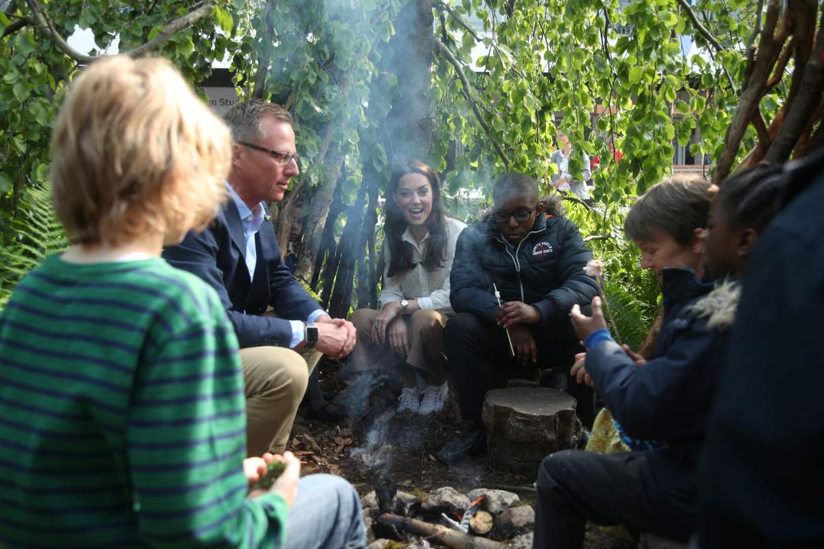 Britain’s Catherine, Duchess of Cambridge, is pictured with Andree Davies and Adam White during a visit to her garden at the RHS Chelsea Flower Show at the Royal Hospital Chelsea, London Britian May 20, 2019.