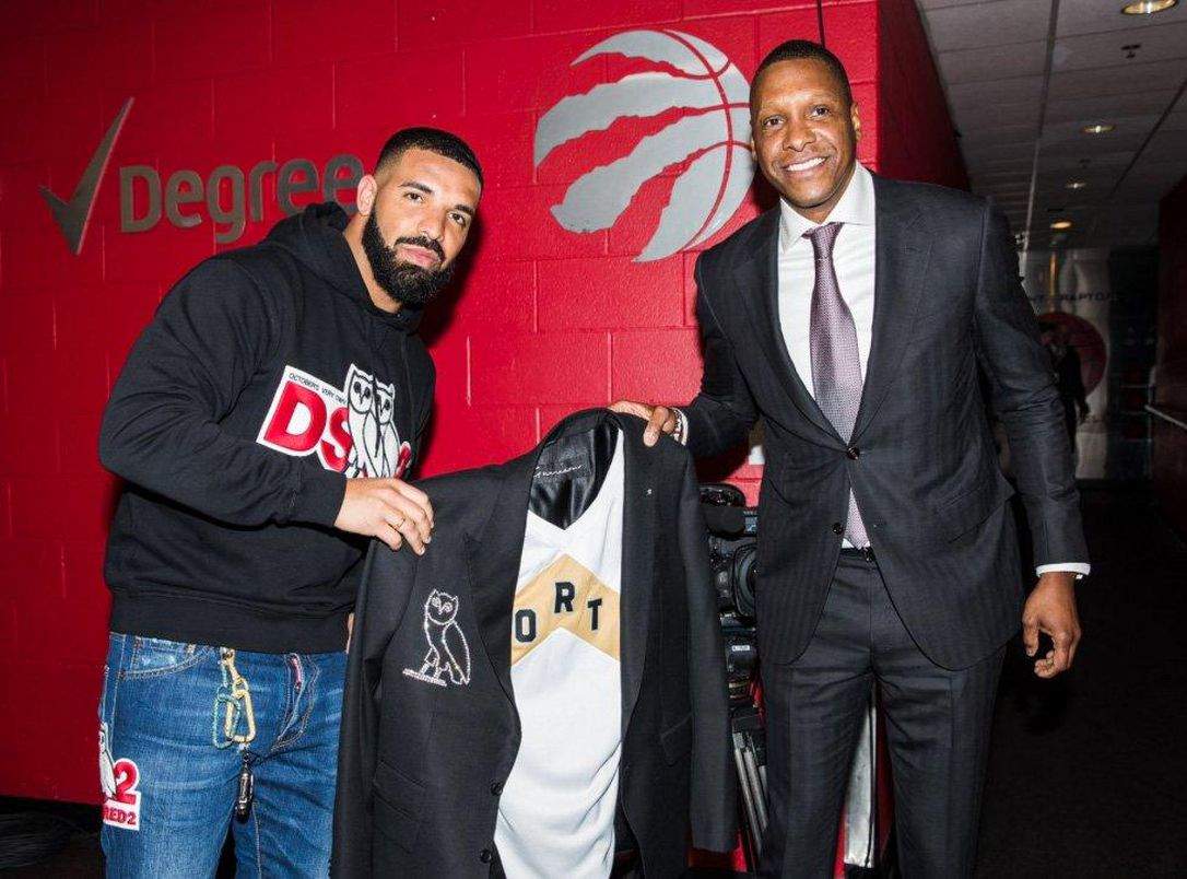 Raptors president Masai Ujiri gives Drake a diamond-crusted jacket on Tuesday night before Game 4 between the Raptors and the Bucks.