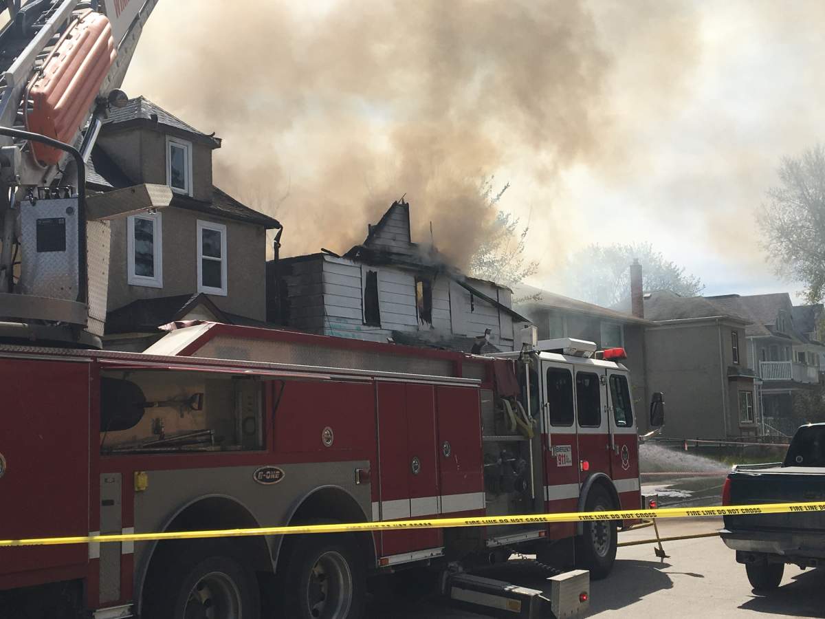 Firefighters on Young street fighting a fire that spread to six different houses.