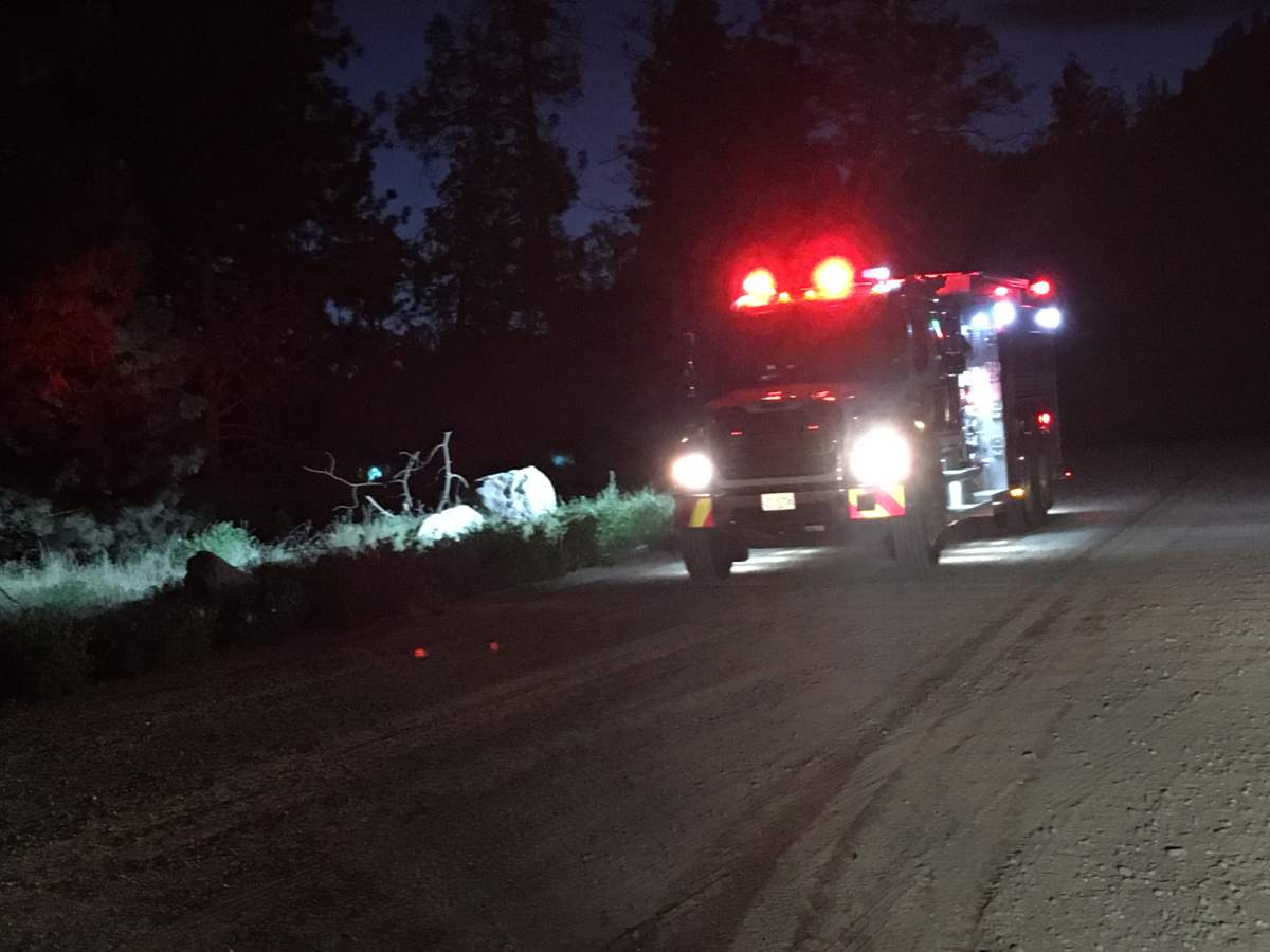 Camper trailer fire sparks small grass fire near West Kelowna - image