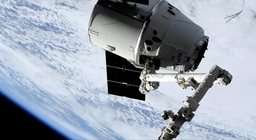 In this image taken from NASA Television, a SpaceX shipment prepares to arrive at the International Space Station following a weekend launch, Monday, May 6, 2019.
