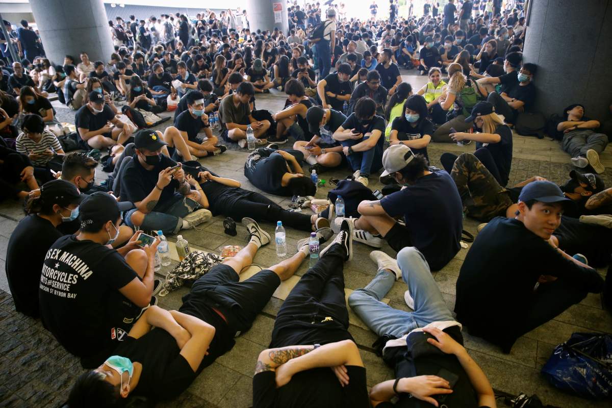 People protesting against the extradition bill rest outside the Legislative Council building in Hong Kong, China, June 17, 2019.
