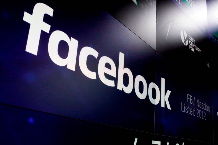 FILE - This March 29, 2018 file photo shows the Facebook logo on screens at the Nasdaq MarketSite in New York's Times Square.