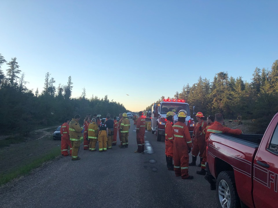 Bonnyville Regional Fire Authority firefighters and crews from Bonnyville, Glendon, La Corey and Iron River as well as Alberta Agriculture and Forestry at the scene of a wildfire near Bonnyville, Alta., on Tuesday, June 4, 2019. 