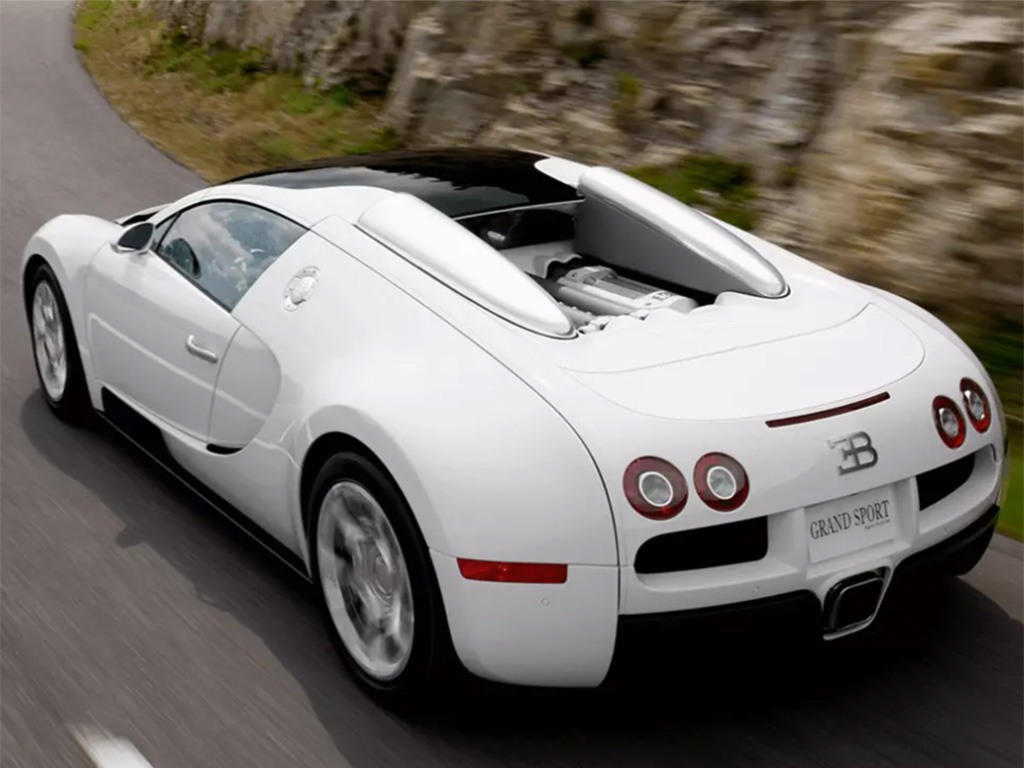 A Veyron 16.4 Grand Sport model Bugatti driving along a mountainside.