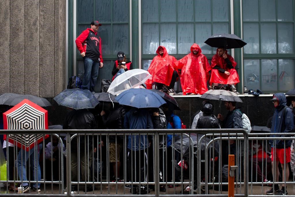 Toronto Raptors fans line up outside the Scotiabank Arena in Toronto on Monday, June 10, 2019, to gain access to Jurassic Park ahead of Game 5 of the NBA Finals. THE CANADIAN PRESS/Chris Young