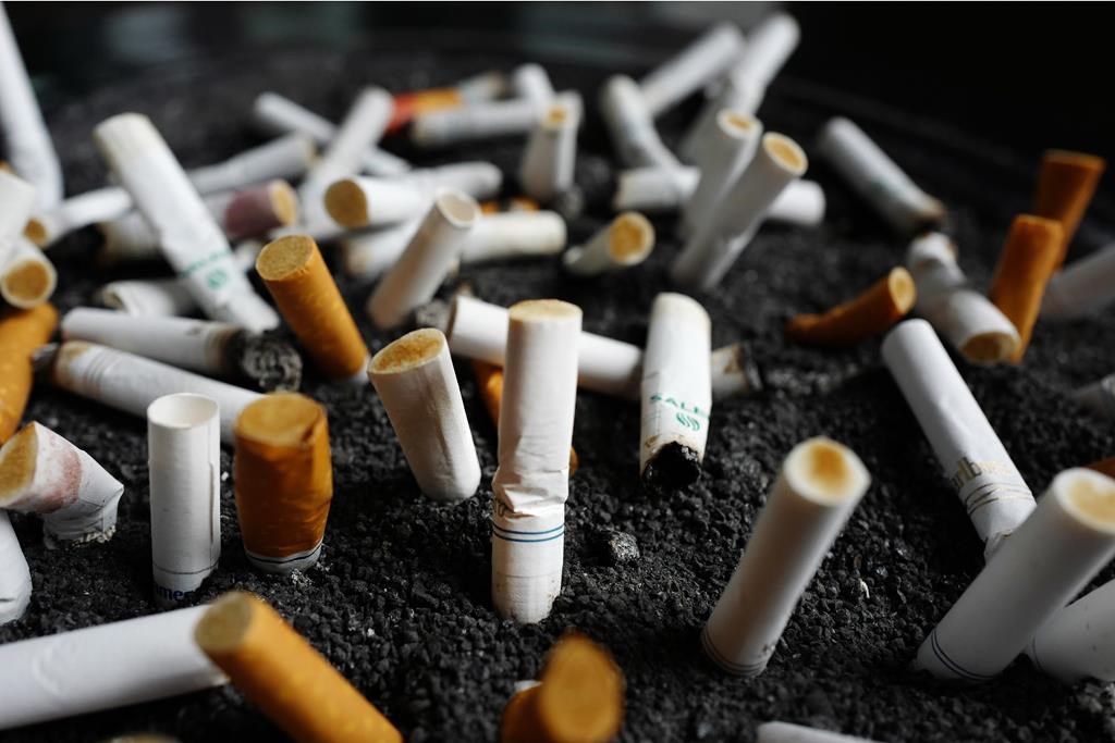 Peterborough police have charged a man who allegedly flicked a cigarette at a grocery store employee on Wednesday.