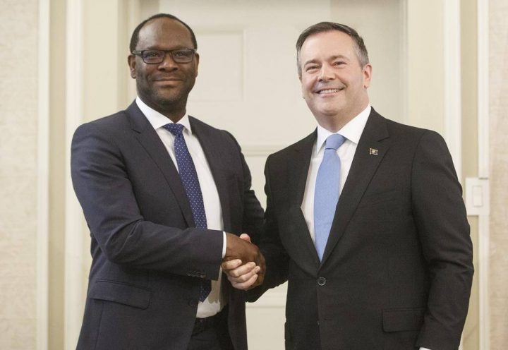 Alberta Premier Jason Kenney shakes hands with Minister of Municipal Affairs Kaycee Madu after being sworn into office in Edmonton on Tuesday April 30, 2019.
