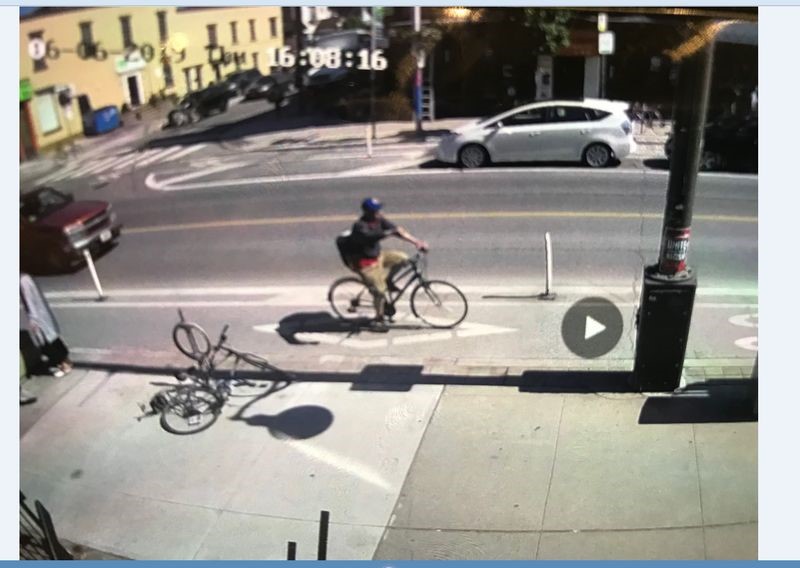 Toronto police say a cyclist has been arrested after he allegedly hurled a bottle of corrosive substance at a family with a baby. 
