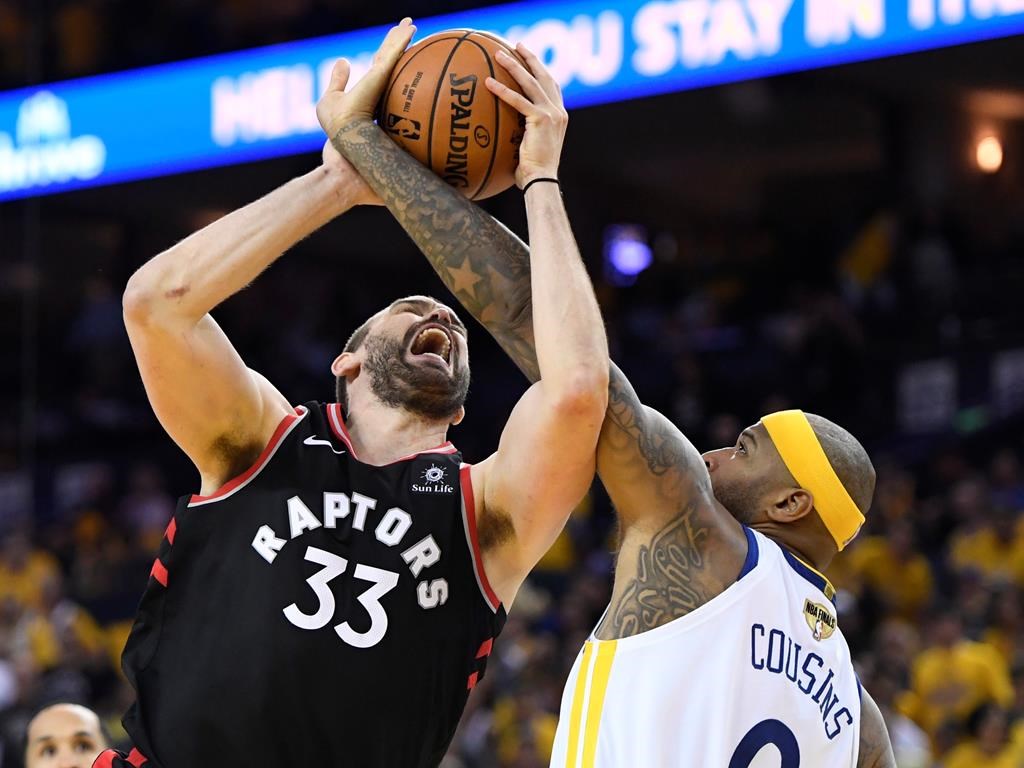 Toronto Raptors centre Marc Gasol,left and Golden State Warriors centre DeMarcus Cousins battle for the ball during second half basketball action in Game 3 of the NBA Finals in Oakland, California on Wednesday.