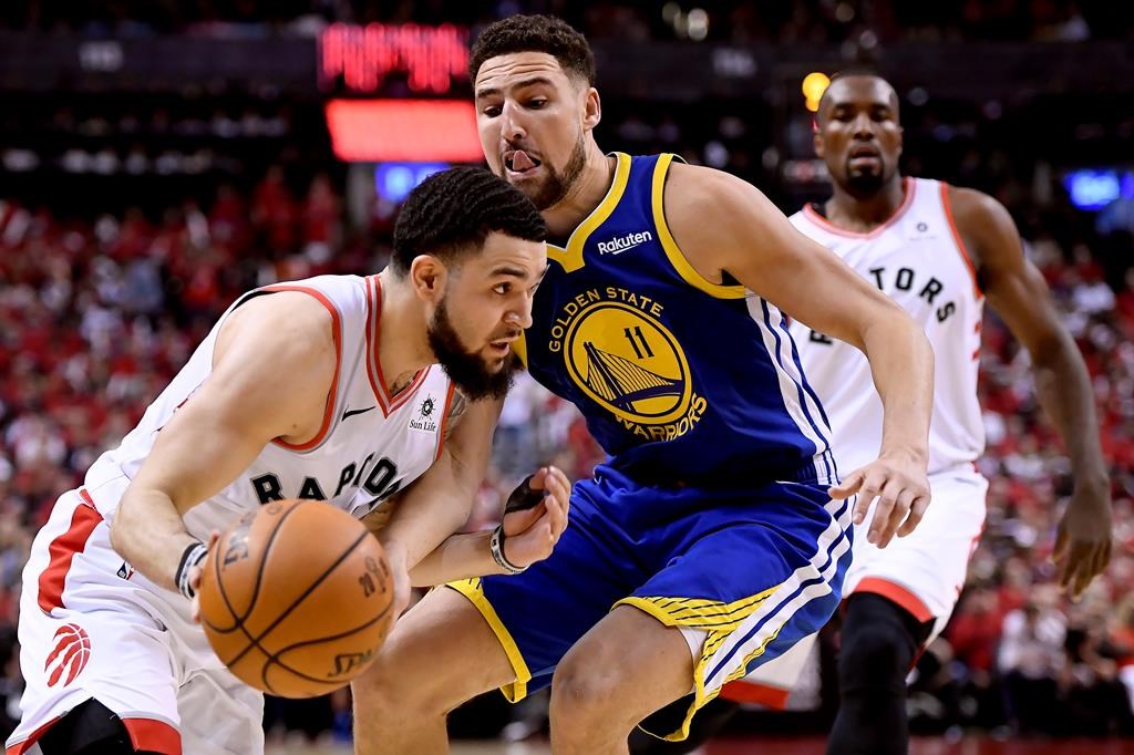 Toronto Raptors guard Fred VanVleet (23) moves the ball around Golden State Warriors guard Klay Thompson (11) during second half Game 2 NBA Finals action, in Toronto on Sunday, June 2, 2019.