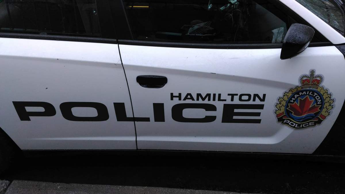 Police say two suspects escaped in a stolen car when their arrest was interrupted by a van smashing into a police cruiser.