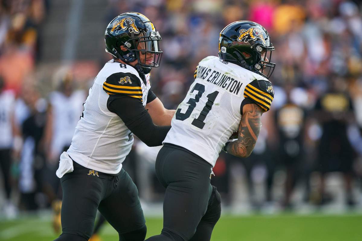 Hamilton Tiger-Cats quarterback Jeremiah Masoli hands off to Sean Thomas Erlington during third quarter CFL action between the Ticats  and the Toronto Argonauts in Toronto on Saturday June 22, 2019.