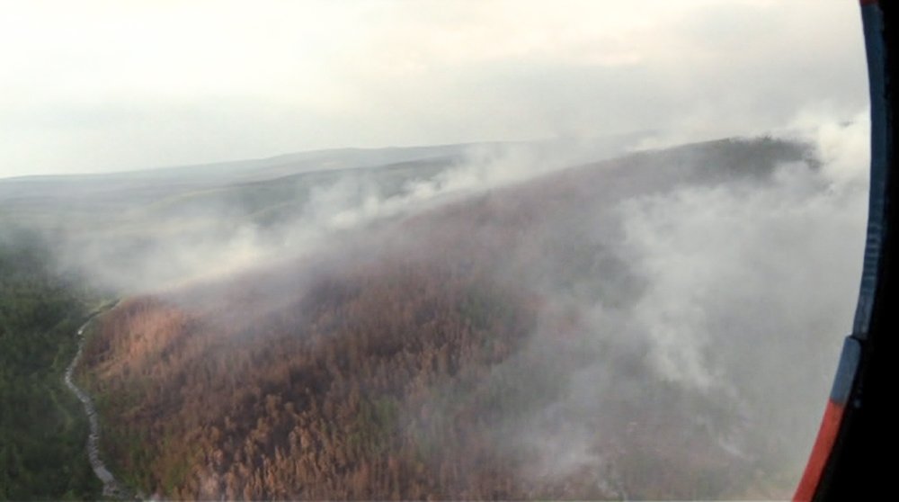 This image made from video provided by RU-RTR Russian television channel shows a view of a forest fire in the Boguchansky district of the Krasnoyarsk region, Russia Far East, Wednesday, July 31, 2019.