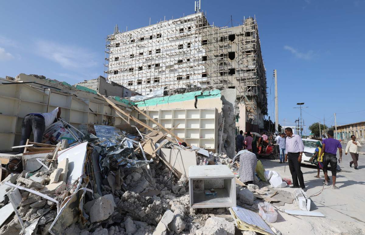 A general view shows people at the scene of a suicide car explosion at a check point near Somali Parliament building in Mogadishu, Somalia June 15, 2019