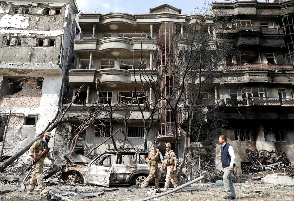 Afghan security forces inspect the site of Sunday's attack in Kabul, Afghanistan July 29, 2019. 
