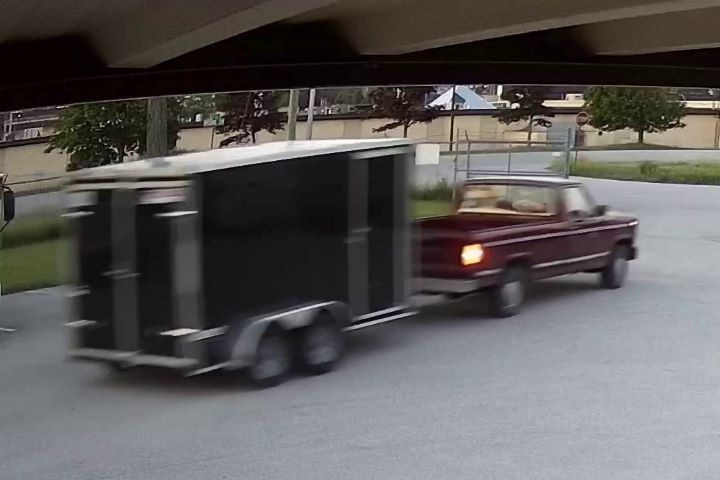 Police are investigating after someone driving a red pickup truck allegedly stole a black enclosed trailer from a Severn Township business on June 22, OPP say.