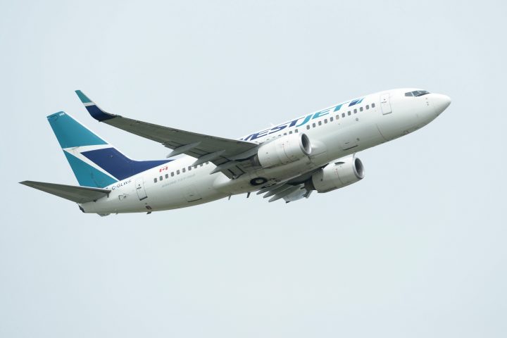 A WestJet plane takes off from Vancouver International Airport in Vancouver on Monday, May 13, 2019. Onex Corp. has signed a friendly deal to buy WestJet Airlines Ltd. in a transaction it valued at $5 billion, including assumed debt. 