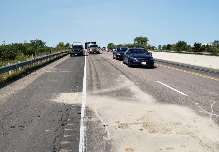 OPP closed two lanes of Highway 401 near Belleville after a tractor-trailer allegedly rear-ended another tractor-trailer on Tuesday morning.