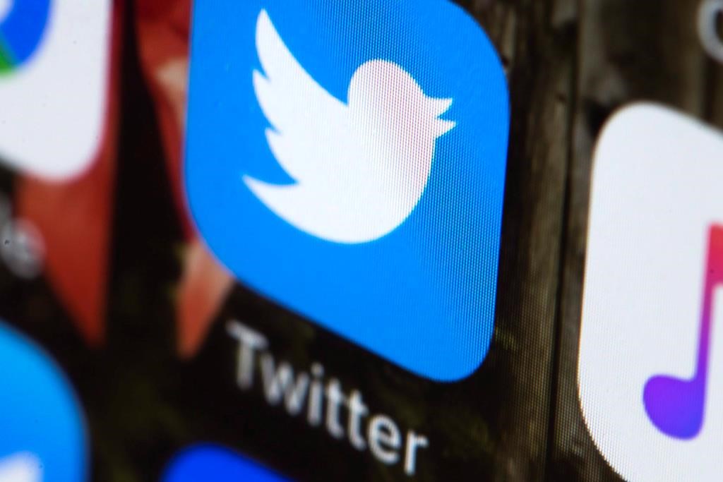 This Wednesday, April 26, 2017, photo shows the Twitter app on a mobile phone in Philadelphia. Twitter says it is launching an experiment in Canada today that will allow users in this country to hide replies to tweets on the social media platform. Other users globally will be able to see the feature and its use, but won't be able to use it themselves. THE CANADIAN PRESS/AP, Matt Rourke.