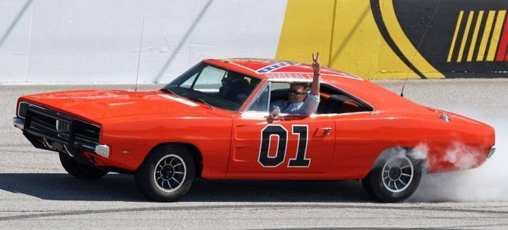 ActorJohn Schnieder star of the 1980's U.S. television show The Dukes of Hazzard, waves from the General Lee before the Kobalt Tools 500 auto race Sunday, March 9, 2008, at Atlanta Motor Speedway in Hampton, Ga. Saskatchewan Premier Scott Moe says he meant no offence by retweeting a photo of a "Dukes of Hazzard"-inspired car adorned with the Confederate flag. THE CANADIAN PRESS/AP-Dale Davis.