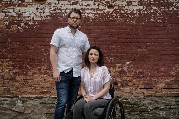 Survivors of the Danforth shooting attack Jerry Pinksen, left, and his partner Danielle Kane pose for a photograph at Liberty Village Park in Toronto on Friday, July 12, 2019.